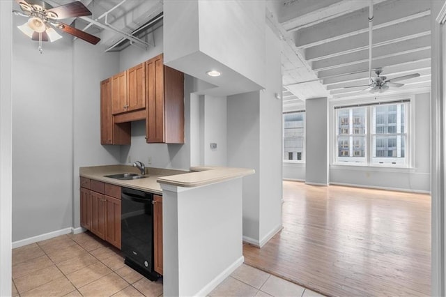 kitchen with sink, dishwasher, ceiling fan, light tile patterned flooring, and kitchen peninsula