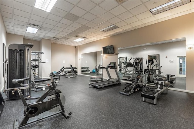 workout area featuring a drop ceiling