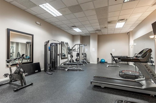 gym featuring a paneled ceiling