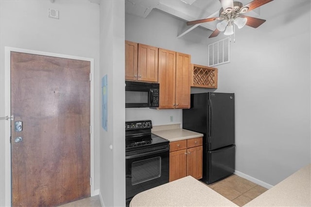 kitchen with ceiling fan, light tile patterned floors, and black appliances