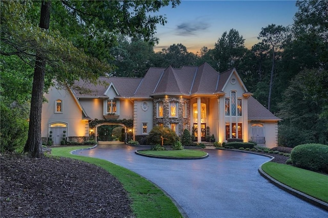 1500 Historic Vw, Stone Mountain, GA 30087 - french country inspired facade featuring curved driveway, stone siding, and stucco siding
