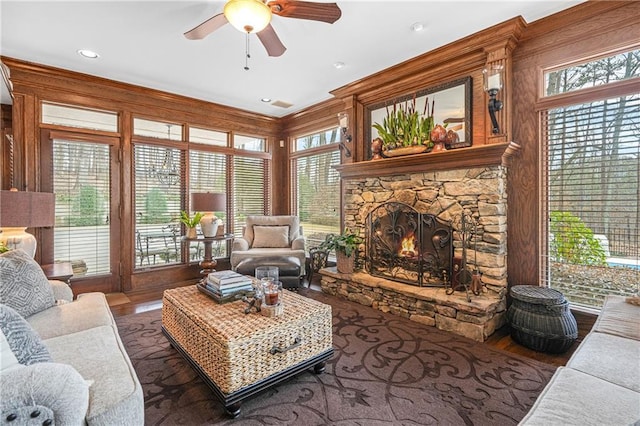 1500 Historic Vw, Stone Mountain, GA 30087 - living area featuring a ceiling fan, a stone fireplace, healthy amount of natural light, and wood finished floors