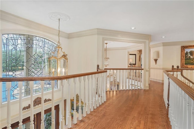1500 Historic Vw, Stone Mountain, GA 30087 - hall with an upstairs landing, healthy amount of natural light, a chandelier, wood finished floors, and crown molding