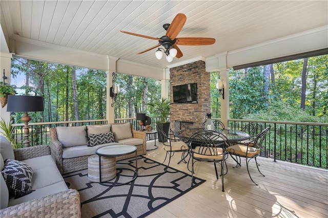 1500 Historic Vw, Stone Mountain, GA 30087 - sunroom / solarium with an outdoor living space with a fireplace, outdoor dining area, ceiling fan, and healthy amount of natural light