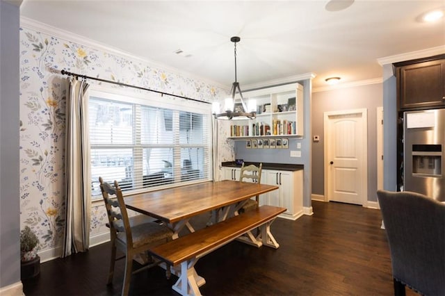 dining space featuring crown molding, dark wood-type flooring, and wallpapered walls