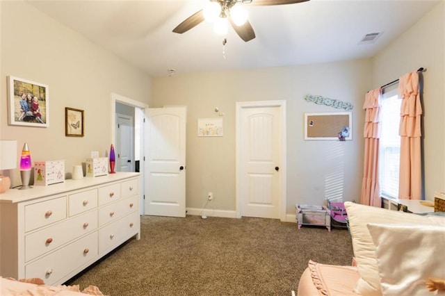 carpeted bedroom with baseboards, visible vents, and a ceiling fan