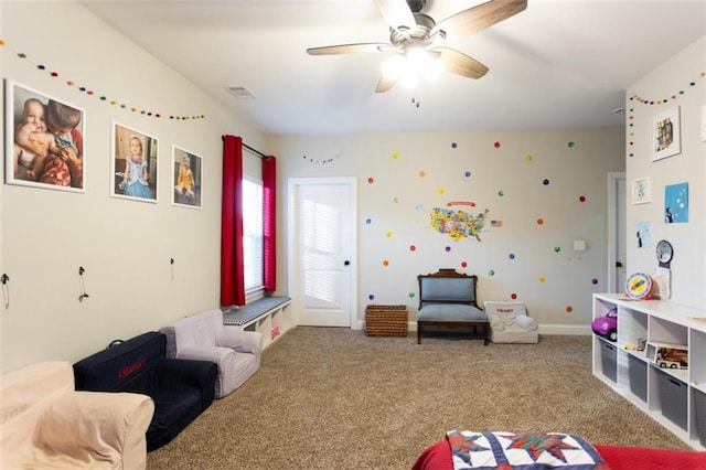 game room with ceiling fan, carpet flooring, visible vents, and baseboards