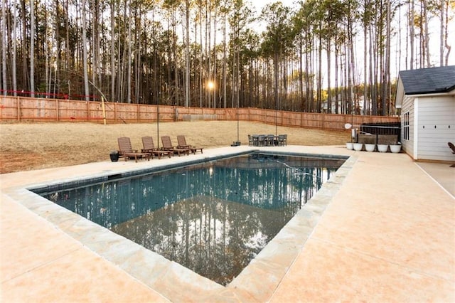 view of pool with a fenced in pool, a patio area, and a fenced backyard