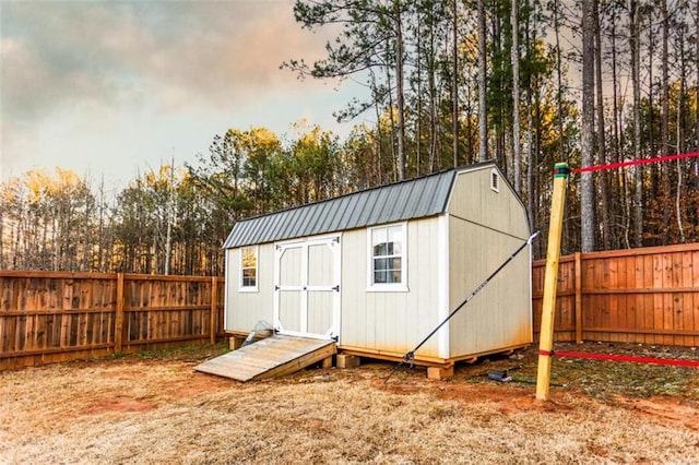 view of shed featuring a fenced backyard