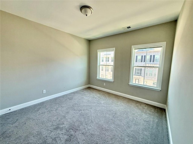 unfurnished room with carpet floors