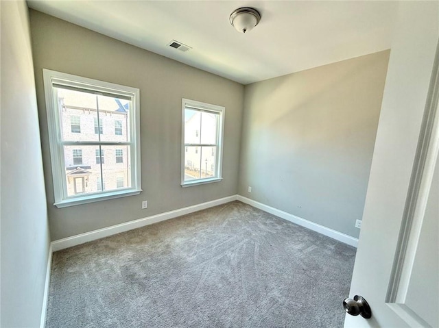 empty room featuring carpet floors