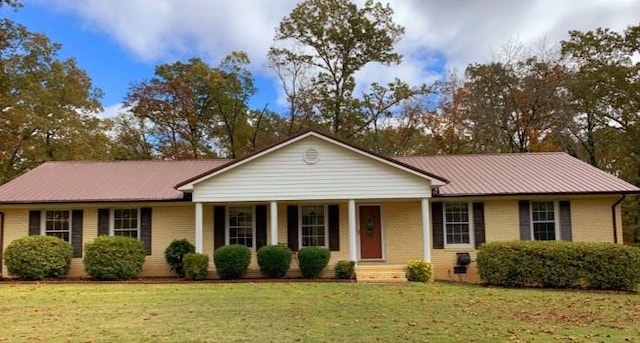 ranch-style home with a front lawn