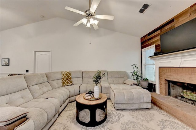 2220 Lily Valley Dr, Lawrenceville, GA 30045 - living room featuring ceiling fan, vaulted ceiling, and a fireplace