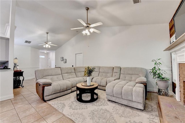 2220 Lily Valley Dr, Lawrenceville, GA 30045 - living room featuring a fireplace, ceiling fan, light tile patterned floors, and lofted ceiling