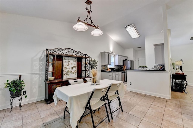 2220 Lily Valley Dr, Lawrenceville, GA 30045 - dining space with light tile patterned flooring and high vaulted ceiling