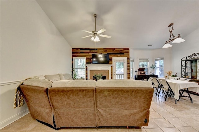 2220 Lily Valley Dr, Lawrenceville, GA 30045 - living room with a ceiling fan, light tile patterned floors, vaulted ceiling, and a fireplace