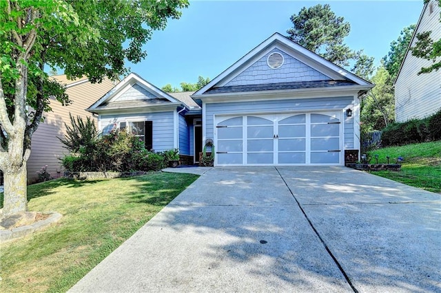 2220 Lily Valley Dr, Lawrenceville, GA 30045 - view of front of house featuring driveway, a front yard, an attached garage, and brick siding
