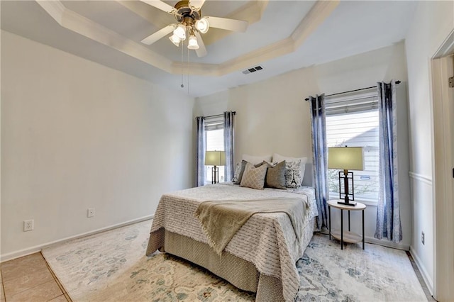 2220 Lily Valley Dr, Lawrenceville, GA 30045 - bedroom featuring a raised ceiling, ornamental molding, light tile patterned floors, and a ceiling fan