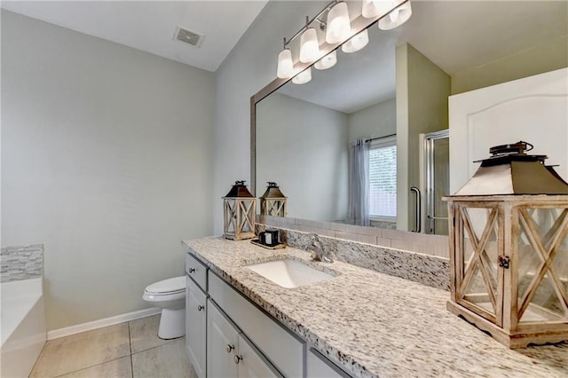 2220 Lily Valley Dr, Lawrenceville, GA 30045 - bathroom with vanity, a shower stall, a garden tub, and tile patterned flooring