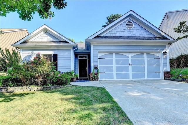 2220 Lily Valley Dr, Lawrenceville, GA 30045 - view of front of house with concrete driveway, a garage, and a front yard