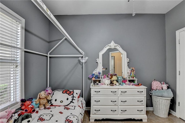 2220 Lily Valley Dr, Lawrenceville, GA 30045 - bedroom featuring multiple windows and light tile patterned floors
