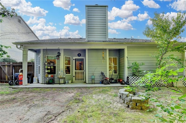 2220 Lily Valley Dr, Lawrenceville, GA 30045 - back of property featuring a chimney