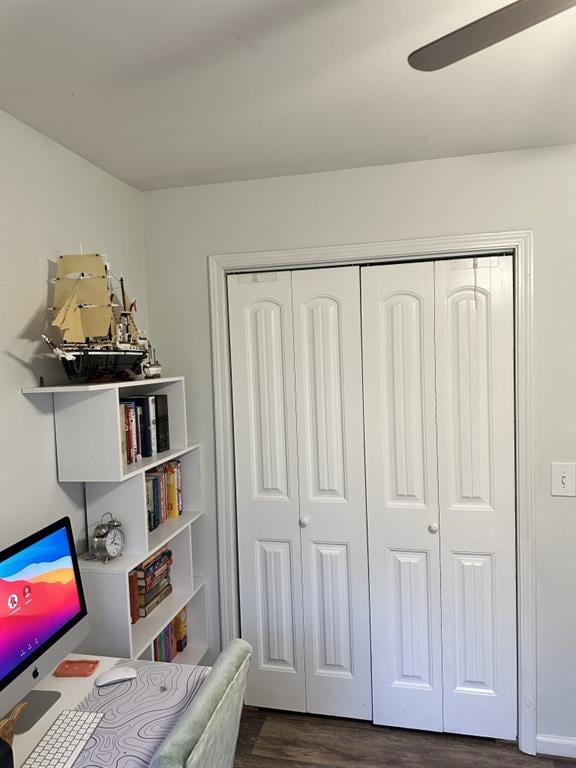 office space featuring ceiling fan and dark hardwood / wood-style flooring