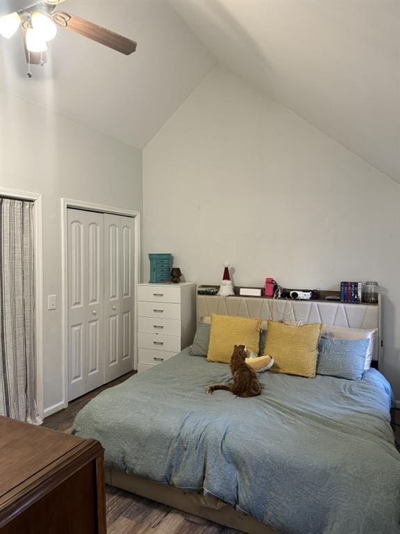 bedroom featuring high vaulted ceiling, a closet, ceiling fan, and hardwood / wood-style flooring