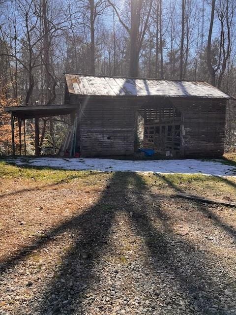 view of outbuilding with a carport