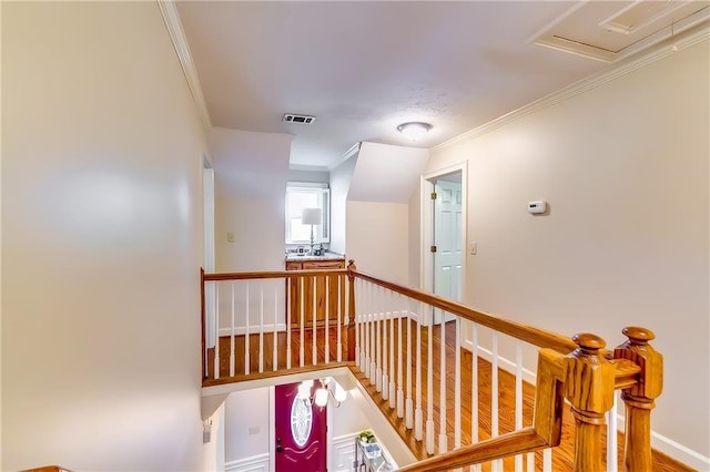 corridor with crown molding and hardwood / wood-style floors