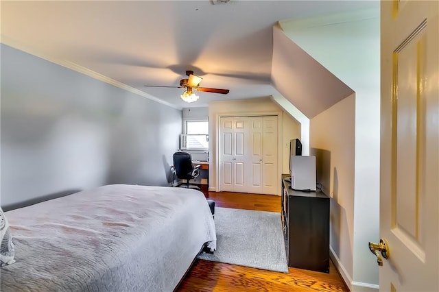 bedroom featuring crown molding, hardwood / wood-style flooring, and ceiling fan