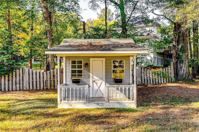 view of outbuilding with a lawn