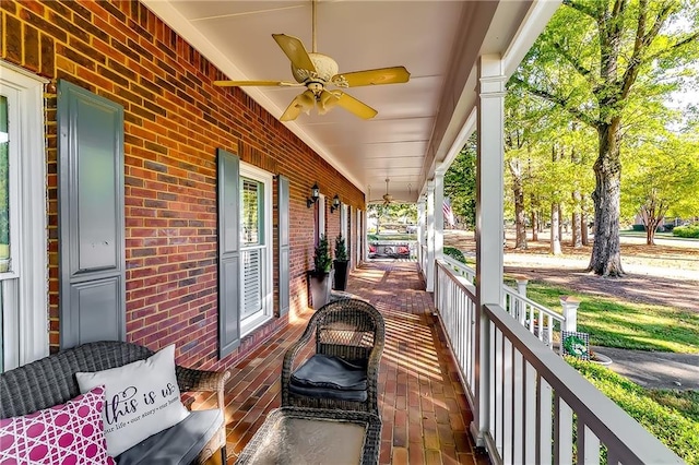 exterior space featuring ceiling fan and a porch