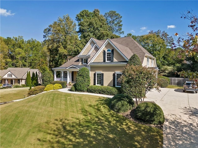 craftsman-style house with a front yard