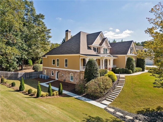 view of home's exterior featuring a lawn and central AC unit