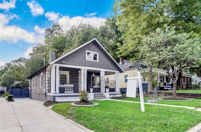1463 Metropolitan Pkwy SW, Atlanta, GA 30310 - view of front of property with a porch, a front yard, a chimney, and driveway
