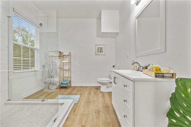 1463 Metropolitan Pkwy SW, Atlanta, GA 30310 - bathroom featuring vanity, toilet, a walk in shower, and wood finished floors