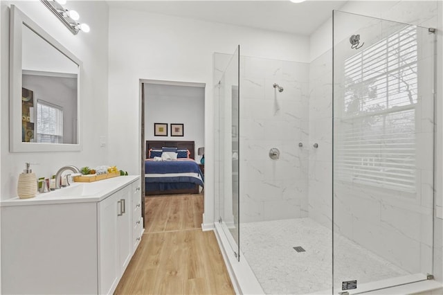 1463 Metropolitan Pkwy SW, Atlanta, GA 30310 - ensuite bathroom featuring vanity, a marble finish shower, and wood finished floors