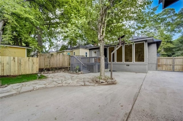 1463 Metropolitan Pkwy SW, Atlanta, GA 30310 - back of property featuring a patio, stucco siding, and stairs