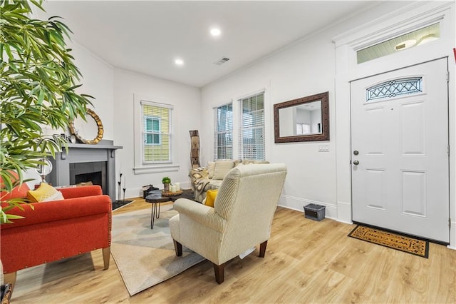 1463 Metropolitan Pkwy SW, Atlanta, GA 30310 - foyer with light wood finished floors, baseboards, crown molding, recessed lighting, and a tiled fireplace