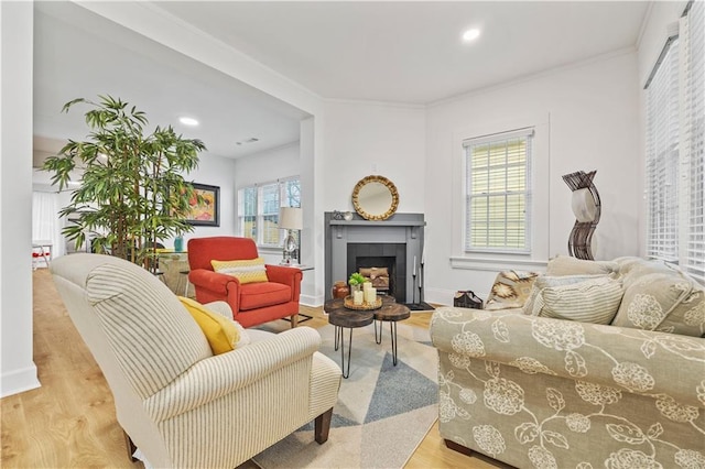 1463 Metropolitan Pkwy SW, Atlanta, GA 30310 - living room with light wood finished floors, a fireplace, crown molding, recessed lighting, and baseboards