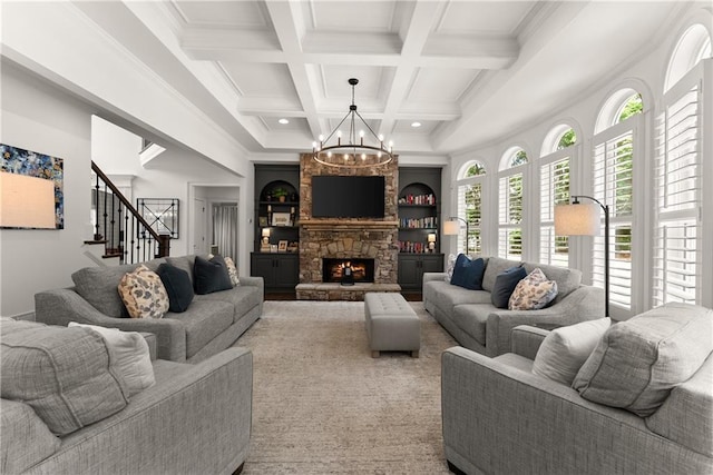 living area with a chandelier, stairs, beam ceiling, coffered ceiling, and built in shelves