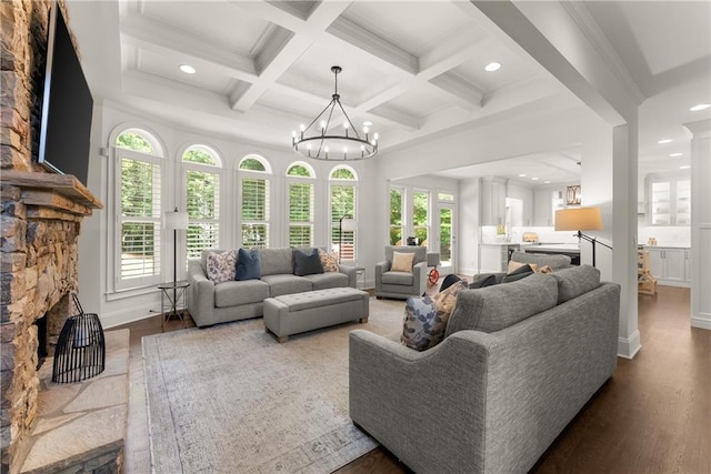 living area with recessed lighting, beam ceiling, wood finished floors, coffered ceiling, and baseboards
