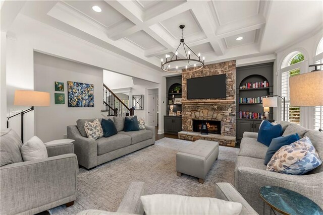 living area featuring a chandelier, stairway, coffered ceiling, beam ceiling, and recessed lighting