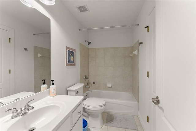full bathroom with tile patterned flooring, bathtub / shower combination, vanity, and toilet