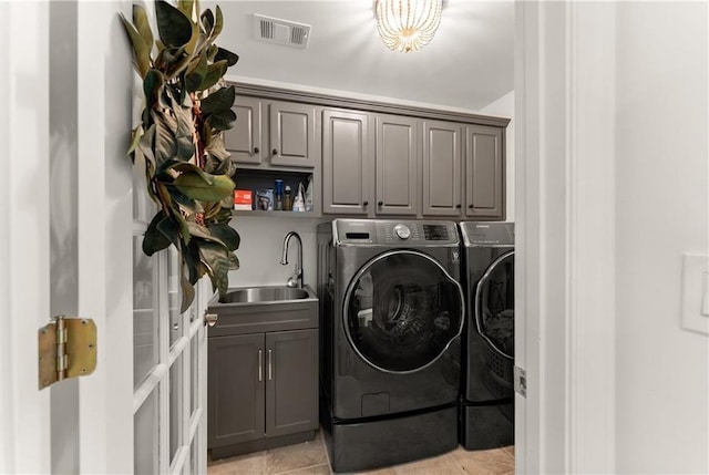 washroom featuring separate washer and dryer and cabinet space
