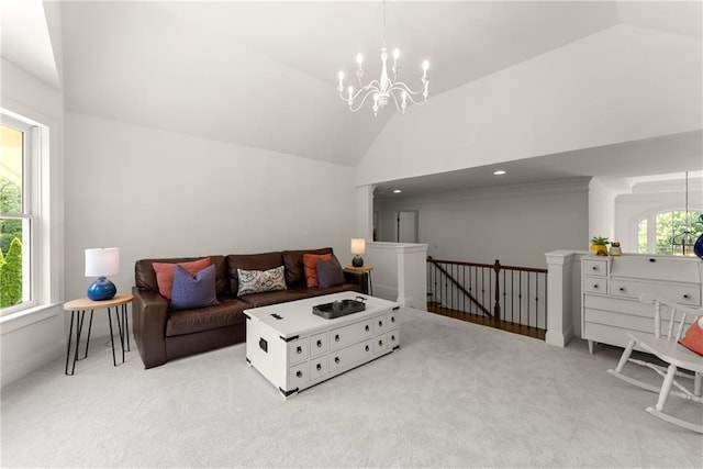 living area featuring a chandelier, carpet, high vaulted ceiling, and baseboards