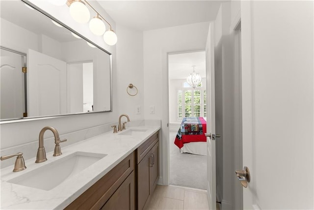 full bath featuring double vanity and connected bathroom