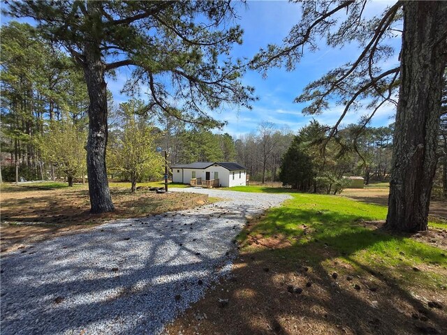 4064 Post Rd, Winston, GA 30187 - exterior space with a front lawn and gravel driveway