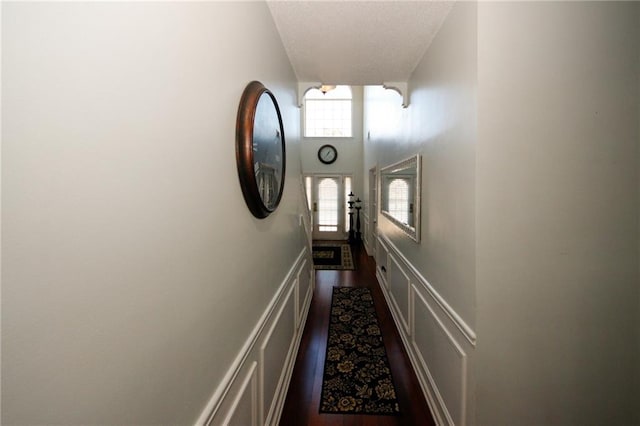 hall with dark hardwood / wood-style flooring